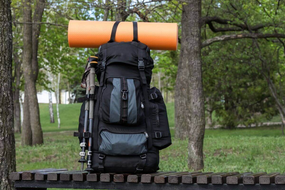 how to attach hiking poles to backpack